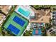Aerial view of community amenities including tennis courts, pool, and clubhouse at 8335 Glenrose Way # 1513, Sarasota, FL 34238