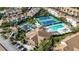 Aerial view of community featuring tennis courts, pool, and clubhouse at 8335 Glenrose Way # 1513, Sarasota, FL 34238