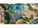 Aerial view of community amenities including pool, tennis courts and shuffleboard at 8335 Glenrose Way # 1513, Sarasota, FL 34238