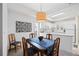 Dining area adjacent to kitchen with decorative table setting at 8335 Glenrose Way # 1513, Sarasota, FL 34238