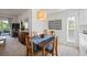 Cozy dining area with four chairs and decorative wall art at 8335 Glenrose Way # 1513, Sarasota, FL 34238