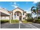 Condo building exterior showcasing entrance and landscaping at 8335 Glenrose Way # 1513, Sarasota, FL 34238