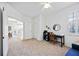Bright home office features desk, seating, and closet space at 8335 Glenrose Way # 1513, Sarasota, FL 34238