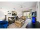 Spacious living room with patio access and comfortable seating at 8335 Glenrose Way # 1513, Sarasota, FL 34238