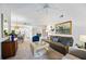 Open living room features ample natural light and a comfy couch at 8335 Glenrose Way # 1513, Sarasota, FL 34238