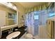 Bathroom with walk-in shower and a black granite countertop at 9413 Andover Cir, Bradenton, FL 34210