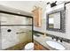 Updated bathroom with granite countertop and walk-in shower at 9413 Andover Cir, Bradenton, FL 34210