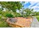 Relaxing community patio with benches and landscaping at 9413 Andover Cir, Bradenton, FL 34210