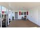Covered patio with seating area, adjacent to garage at 9413 Andover Cir, Bradenton, FL 34210