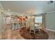 Dining room with wood flooring and a round glass table at 9413 Andover Cir, Bradenton, FL 34210