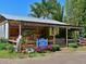 Rustic farm market stand with fresh produce and flowers at 9413 Andover Cir, Bradenton, FL 34210