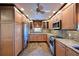 Open concept kitchen with stainless steel appliances and tile flooring at 9413 Andover Cir, Bradenton, FL 34210