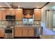 Modern kitchen with granite countertops and stainless steel appliances at 9413 Andover Cir, Bradenton, FL 34210