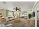 Spacious living room with a white sofa and access to a patio at 9413 Andover Cir, Bradenton, FL 34210