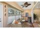 Charming sunroom with built-in bar and comfortable seating at 9413 Andover Cir, Bradenton, FL 34210