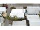 Aerial view of community showing the rooftops, street, and some landscaping at 2601 Gulf N Dr # 613, Bradenton Beach, FL 34217