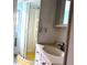 Bathroom featuring a stand-up shower and a vanity sink with built-in drawers at 2601 Gulf N Dr # 613, Bradenton Beach, FL 34217