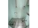 Small unfinished bathroom with a tiled floor and exposed plumbing at 2601 Gulf N Dr # 613, Bradenton Beach, FL 34217