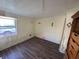 Cozy bedroom features wood floors and a sunny window, creating a relaxing atmosphere at 2601 Gulf N Dr # 613, Bradenton Beach, FL 34217
