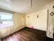 Bedroom features wood floors and a sunny window, creating a relaxing atmosphere at 2601 Gulf N Dr # 613, Bradenton Beach, FL 34217