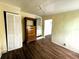 Bedroom featuring wood-look floors, closet, and a neutral color palette, ready for personalization at 2601 Gulf N Dr # 613, Bradenton Beach, FL 34217
