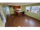 Open concept floor plan featuring wood flooring and a breakfast bar that connects to the kitchen at 2601 Gulf N Dr # 613, Bradenton Beach, FL 34217