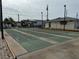 Community shuffleboard courts with surrounding landscape and buildings at 2601 Gulf N Dr # 613, Bradenton Beach, FL 34217