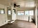 Bright sunroom featuring laminate floors, white walls, and natural light at 2601 Gulf N Dr # 613, Bradenton Beach, FL 34217