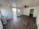 Bright sunroom featuring laminate floors, white walls, and natural light at 2601 Gulf N Dr # 613, Bradenton Beach, FL 34217