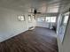 Bright sunroom featuring laminate floors, white walls, and natural light at 2601 Gulf N Dr # 613, Bradenton Beach, FL 34217