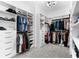 Spacious walk-in closet with custom shelving and a decorative light fixture at 10120 Carnoustie Pl, Bradenton, FL 34211