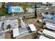 Aerial view showing community pool, bocce ball courts, and surrounding buildings at 10315 Cortez W Rd # 58-3, Bradenton, FL 34210