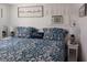 Comfortable bedroom with a king-size bed and blue bedding at 10315 Cortez W Rd # 58-3, Bradenton, FL 34210