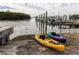 Two kayaks on the beach near the water at 10315 Cortez W Rd # 58-3, Bradenton, FL 34210