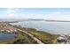 Wide aerial view of coastal area showing waterfront property and calm waters at 10390 Longshore Rd # 83, Placida, FL 33946