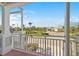 Balcony view overlooking a park-like setting with palm trees at 10390 Longshore Rd # 83, Placida, FL 33946