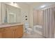 Bathroom with single vanity, toilet, and tub shower combo at 10390 Longshore Rd # 83, Placida, FL 33946