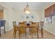 Bright dining room with wood table and chairs at 10390 Longshore Rd # 83, Placida, FL 33946