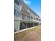 Exterior view of building, showing multiple balconies at 10390 Longshore Rd # 83, Placida, FL 33946