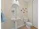 Small powder room with pedestal sink and toilet at 10390 Longshore Rd # 83, Placida, FL 33946