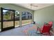 Screened porch with comfy seating and view of nature at 10390 Longshore Rd # 83, Placida, FL 33946