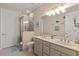 Bright bathroom with double sinks, neutral color scheme, glass shower, and decorative accents at 109 Porta Vecchio Bnd # 202, Nokomis, FL 34275