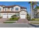 Charming townhome with a tile roof, attached garage, and well-manicured landscaping at 109 Porta Vecchio Bnd # 202, Nokomis, FL 34275