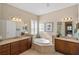 Large bathroom with soaking tub and double vanities at 110 Asti Ct, North Venice, FL 34275