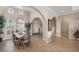 Bright and spacious entryway with high ceilings, arched doorways and tile floors leading to other rooms at 110 Asti Ct, North Venice, FL 34275