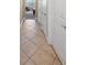 Light and airy hallway with tile flooring at 110 Asti Ct, North Venice, FL 34275