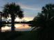 Stunning sunset view over calm lake waters at 110 Asti Ct, North Venice, FL 34275