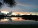 Beautiful sunset reflected in the lake water at 110 Asti Ct, North Venice, FL 34275