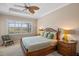 Main bedroom with large window and ceiling fan at 110 Asti Ct, North Venice, FL 34275