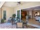 Outdoor patio with seating area and view into the kitchen at 110 Asti Ct, North Venice, FL 34275